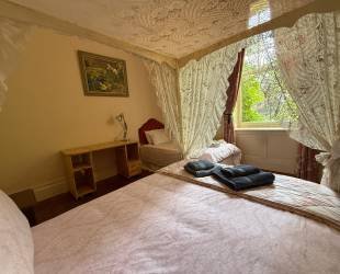Double room with four posted bed, ensuite bathroom and amazing views