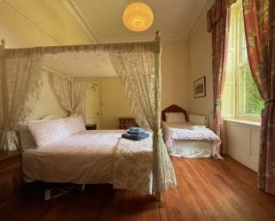 Double room with four posted bed, ensuite bathroom and amazing views
