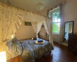 Double room with four posted bed, ensuite bathroom and amazing views