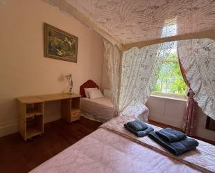 Double room with four posted bed, ensuite bathroom and amazing views