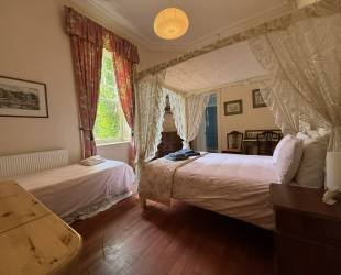 Double room with four posted bed, ensuite bathroom and amazing views