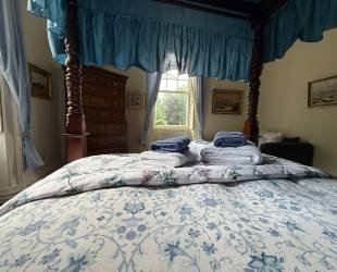 Master Bedroom with four posted bed,  garden and river view