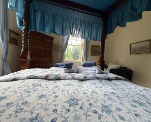 Master Bedroom with four posted bed,  garden and river view