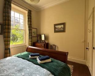 Double bedroom with garden and woodland view