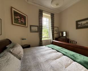 Double bedroom with garden and woodland view