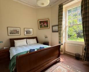Double bedroom with garden and woodland view