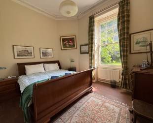 Double bedroom with garden and woodland view