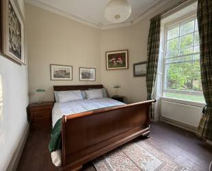 Double bedroom with garden and woodland view
